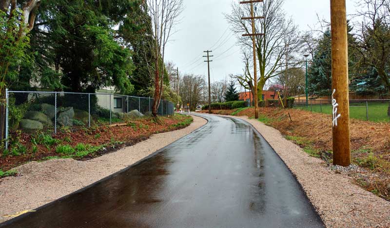 With paving of the temporary pathway complete, the Arbutus Greenway veers toward the community gardens at 6th, Photo: Naomi Reichstein